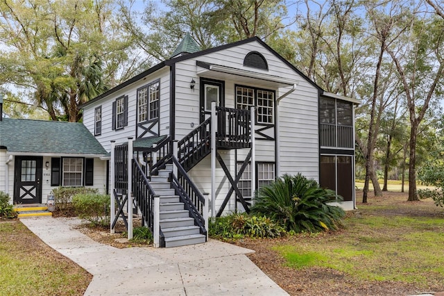 view of front of home with a sunroom