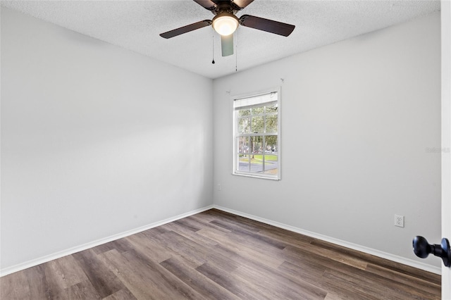 empty room with ceiling fan, a textured ceiling, and hardwood / wood-style flooring