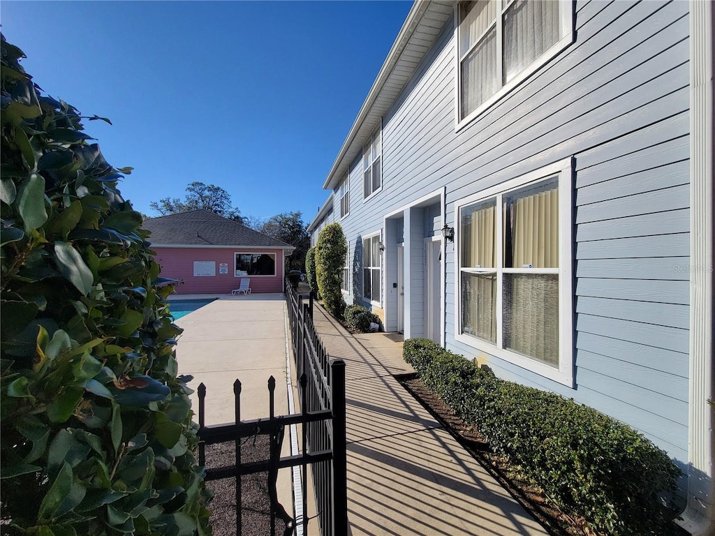 view of side of home with a patio