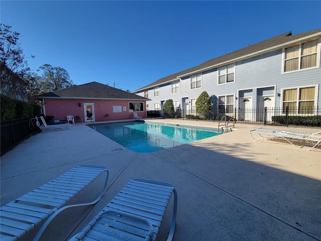 view of swimming pool featuring a patio area