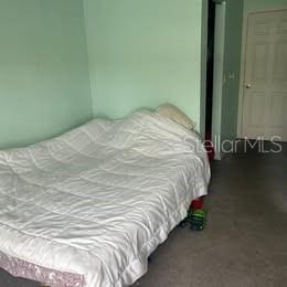 3930 SW 20th Ave Unit 1905, Gainesville, FL 32607 - bedroom featuring carpet floors