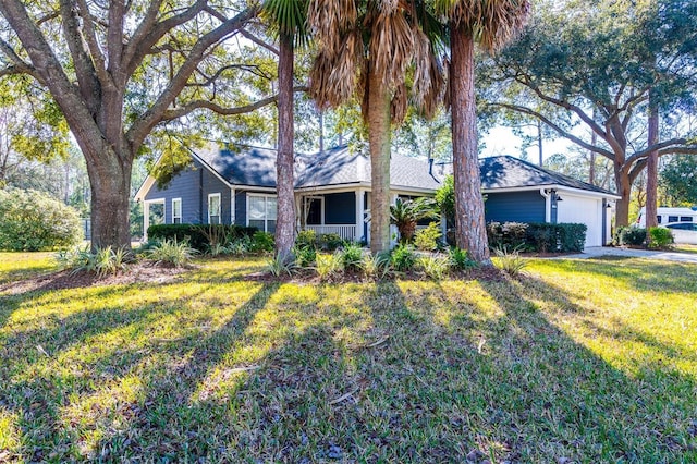 single story home with a garage and a front lawn