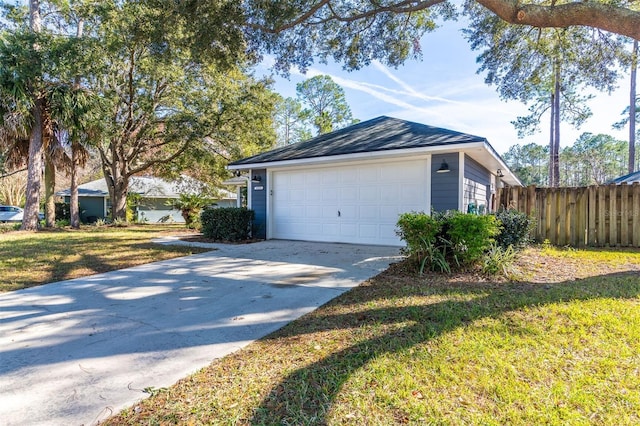 garage featuring a lawn