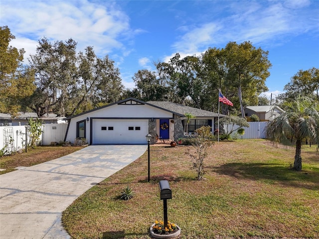 view of front of property with a front yard and a garage