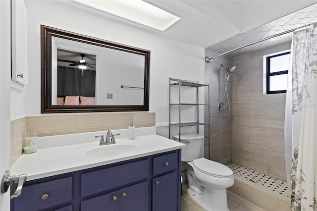 bathroom featuring vanity, walk in shower, and toilet