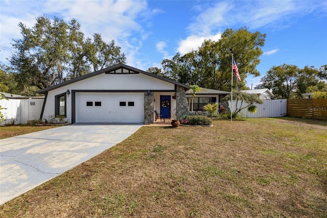 ranch-style house featuring a garage and a front yard