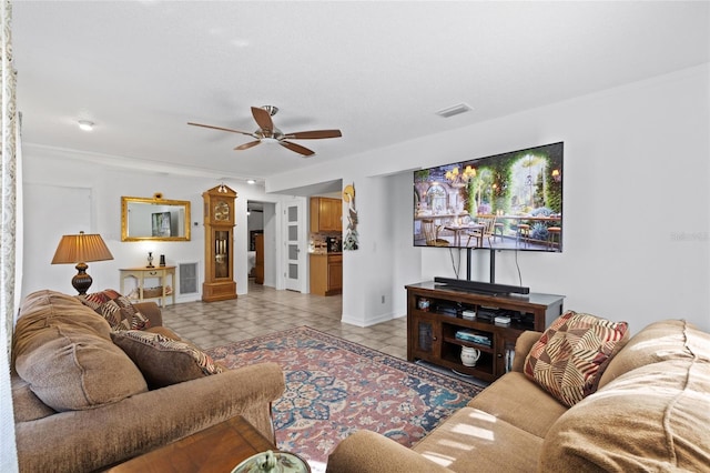 living room featuring light tile patterned floors and ceiling fan