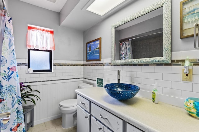 bathroom with tile patterned floors, vanity, and toilet