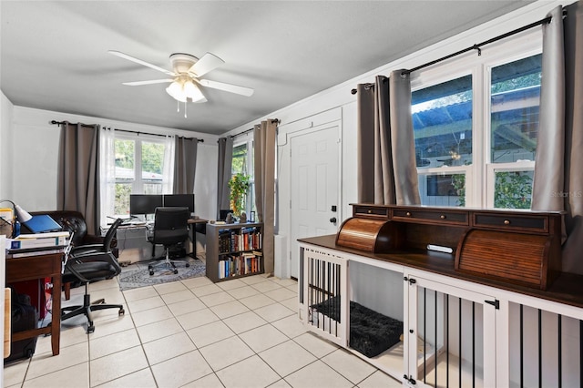 home office featuring light tile patterned floors and ceiling fan