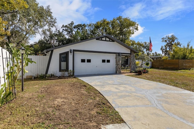 view of front of house with a garage and a front lawn