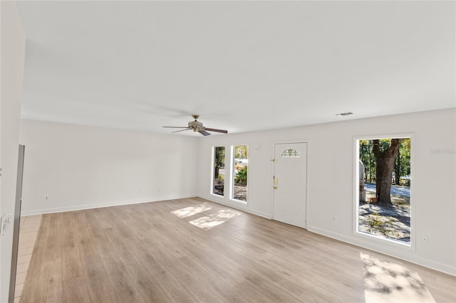 unfurnished living room with light hardwood / wood-style floors and ceiling fan