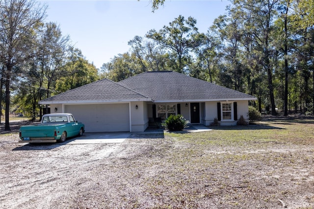 single story home featuring a garage