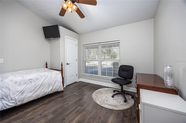 bedroom with dark hardwood / wood-style flooring and ceiling fan