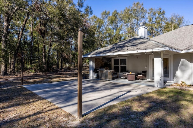 exterior space with an outdoor living space and a patio area