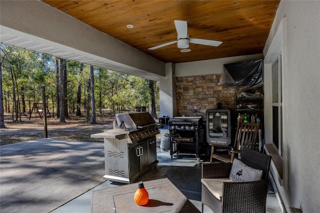 view of patio / terrace with grilling area and ceiling fan