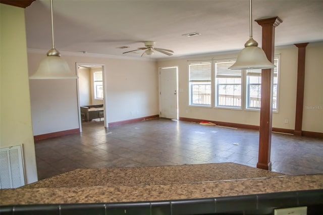 spare room with ceiling fan and ornamental molding