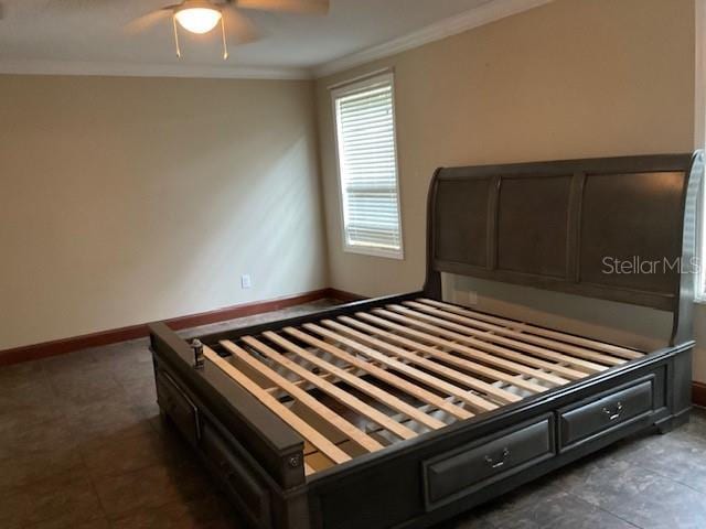 unfurnished bedroom with ceiling fan and ornamental molding