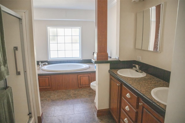 full bathroom featuring toilet, separate shower and tub, and vanity