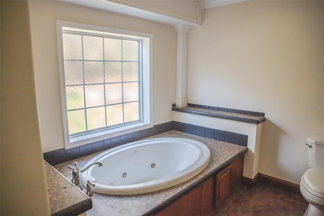 bathroom with plenty of natural light, toilet, and a tub to relax in