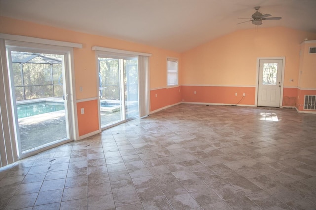 interior space with lofted ceiling and ceiling fan