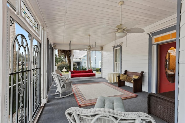 sunroom / solarium with ceiling fan