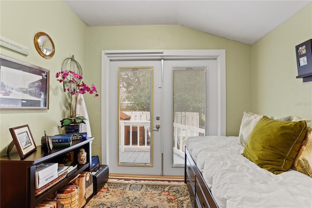 sitting room featuring lofted ceiling and french doors