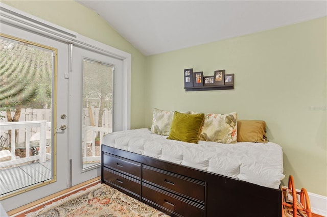 bedroom with lofted ceiling