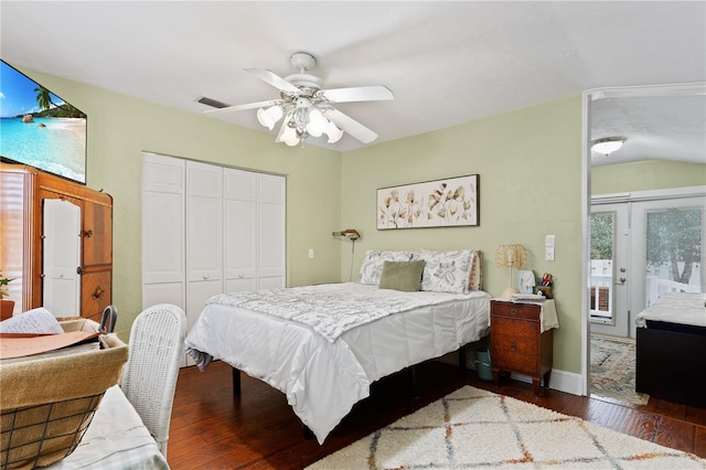 bedroom with access to exterior, dark wood-type flooring, a closet, and ceiling fan