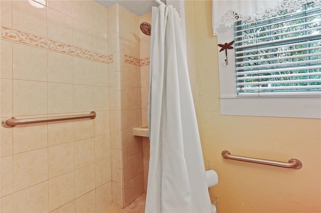 bathroom with a shower with shower curtain