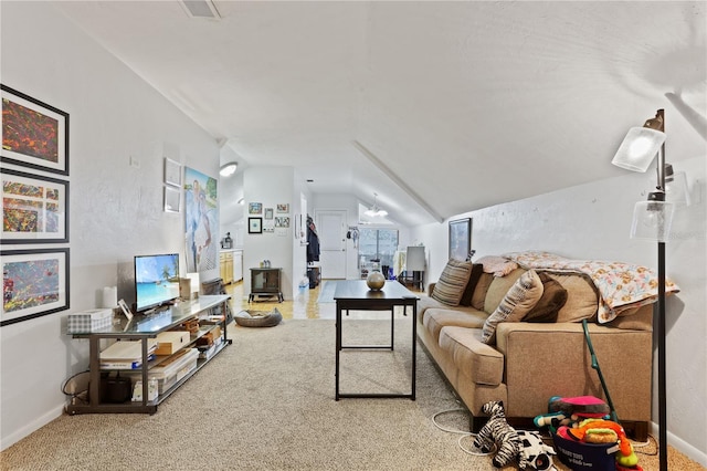 carpeted living room with vaulted ceiling