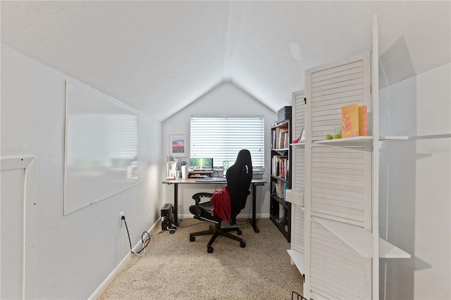 office featuring lofted ceiling and carpet flooring