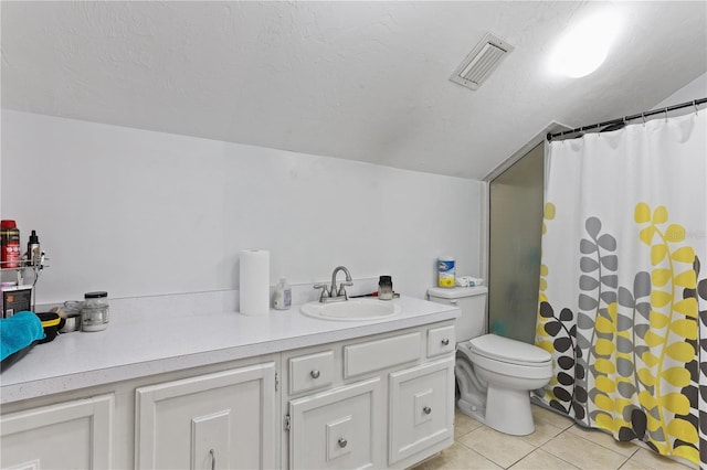 bathroom featuring lofted ceiling, vanity, a shower with curtain, tile patterned floors, and toilet