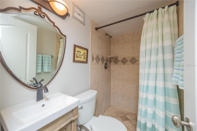 bathroom featuring vanity, toilet, and a shower with curtain