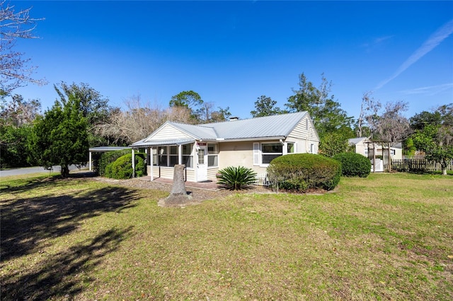 single story home with a front lawn and a sunroom