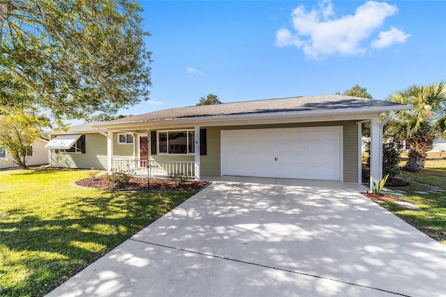 ranch-style house featuring a garage, covered porch, and a front lawn