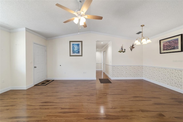 unfurnished room with dark wood-type flooring, ornamental molding, and vaulted ceiling