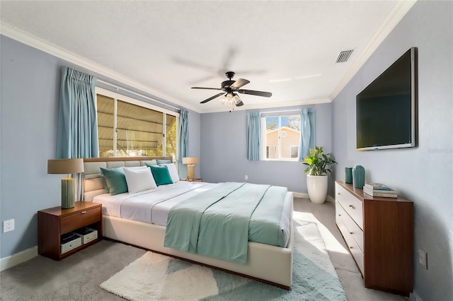 bedroom featuring crown molding, ceiling fan, and light carpet