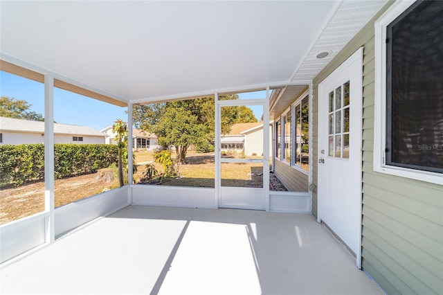 unfurnished sunroom featuring plenty of natural light