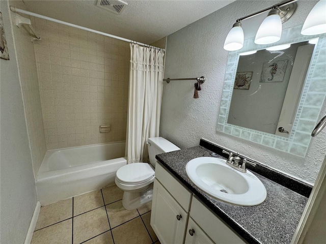 full bathroom featuring shower / bath combination with curtain, tile patterned flooring, vanity, toilet, and a textured ceiling