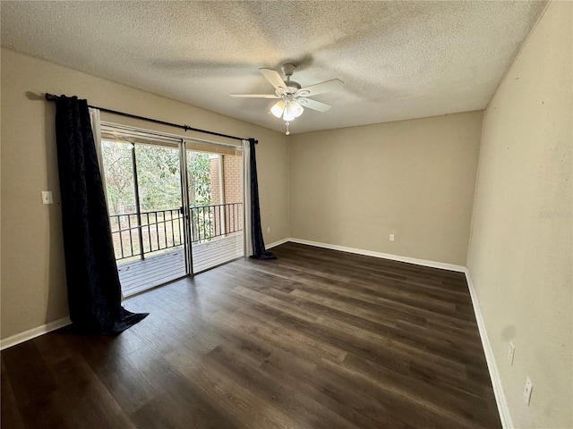 unfurnished room with ceiling fan, dark hardwood / wood-style floors, and a textured ceiling