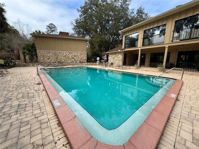 view of pool featuring a patio