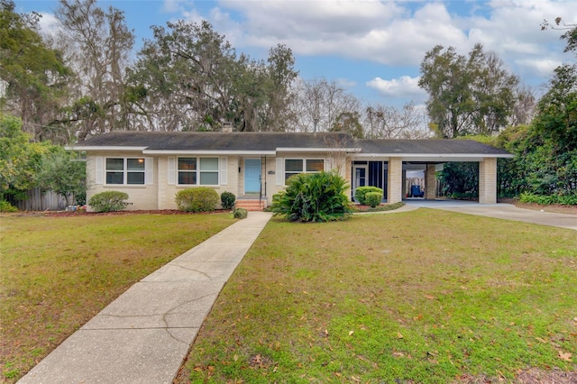 single story home featuring a carport and a front lawn