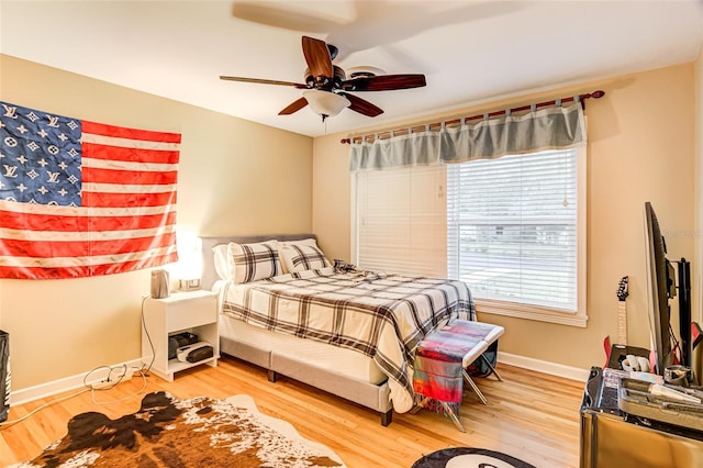 bedroom featuring ceiling fan and hardwood / wood-style floors