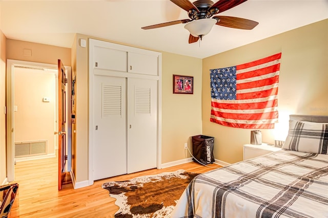 bedroom featuring a closet, ceiling fan, and light hardwood / wood-style flooring