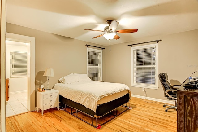 bedroom with ceiling fan and light wood-type flooring