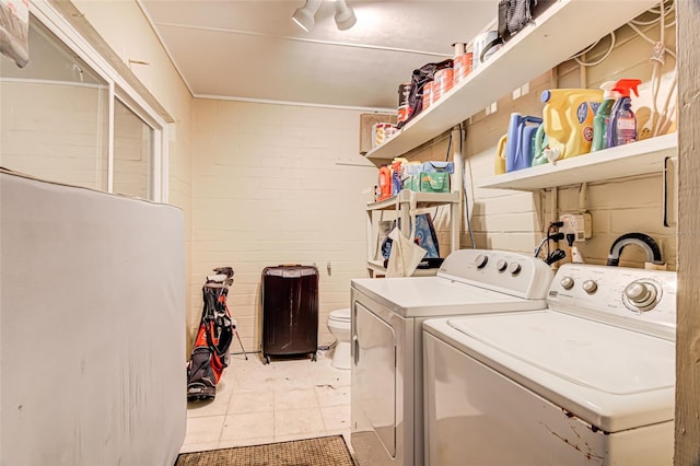 laundry room with separate washer and dryer and tile patterned floors