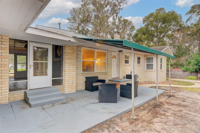 back of property featuring a patio area