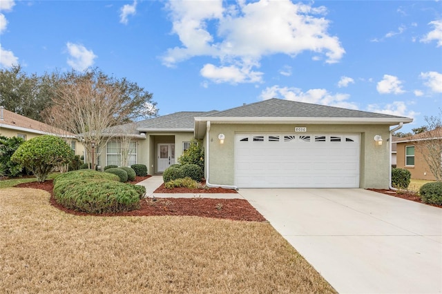 ranch-style home featuring a garage and a front yard