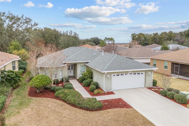 ranch-style home featuring a garage and a front yard