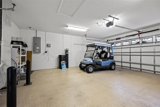 garage featuring a garage door opener and electric panel